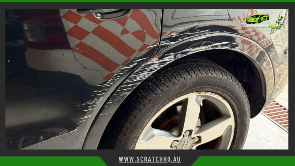 scratched car paint surface