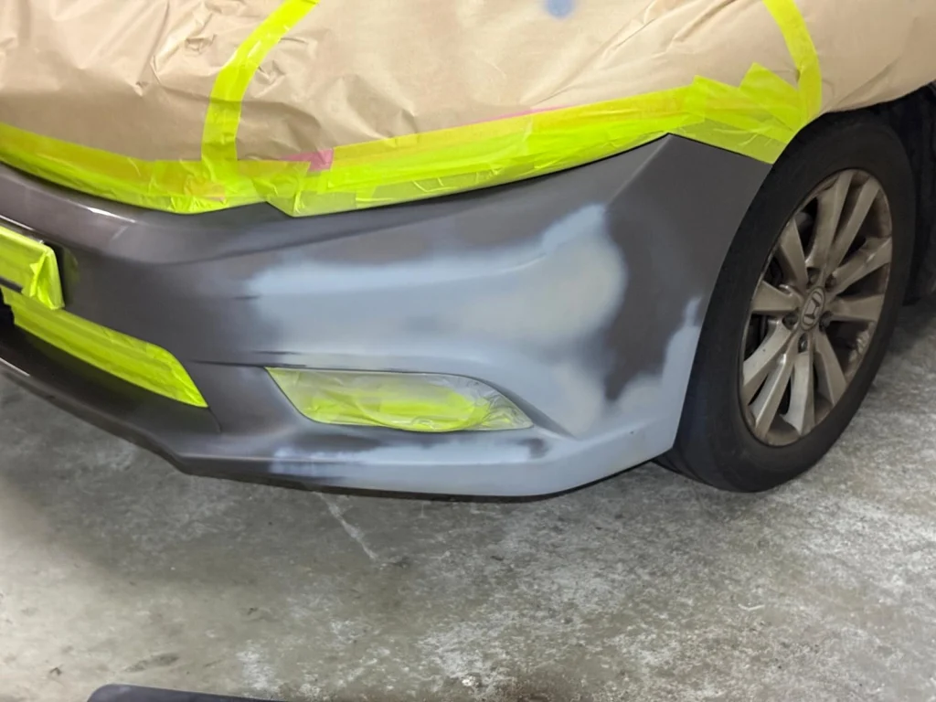 Gray Honda Civic left corner bumper repair