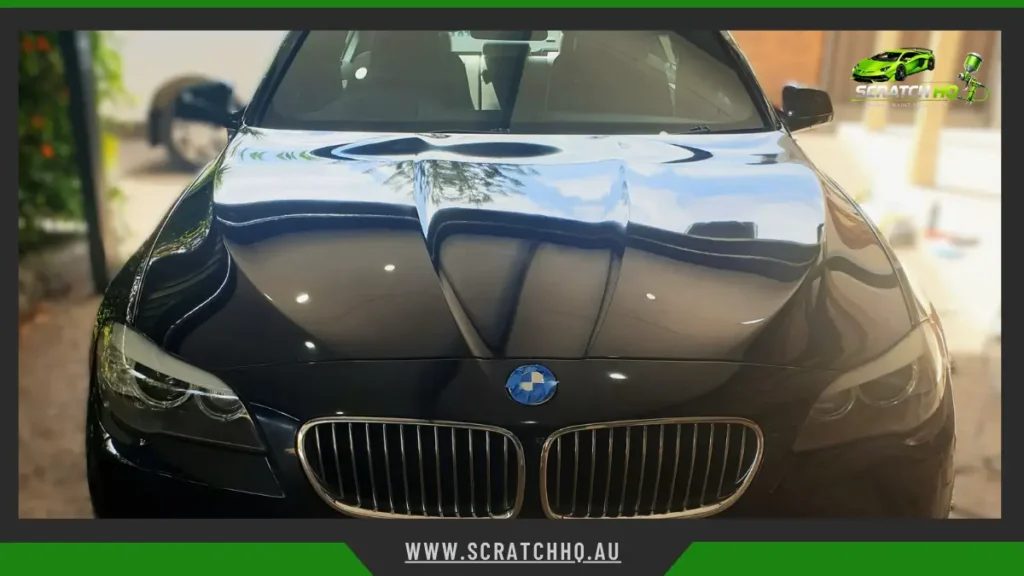 black bmw sedan enhanced with professional paint correction and ceramic coating for an exceptional mirror-like shine