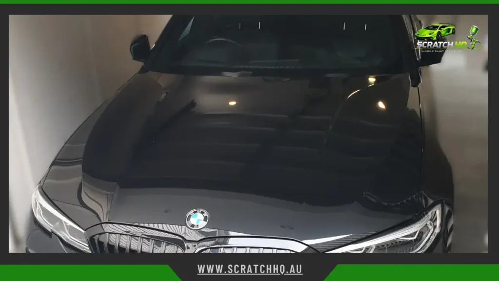 black bmw sedan with ceramic coating, delivering a deep mirror-like gloss and long-lasting paint protection